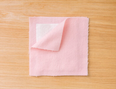 three layers of fabric laid on top of each other with the top pink one&hellip;